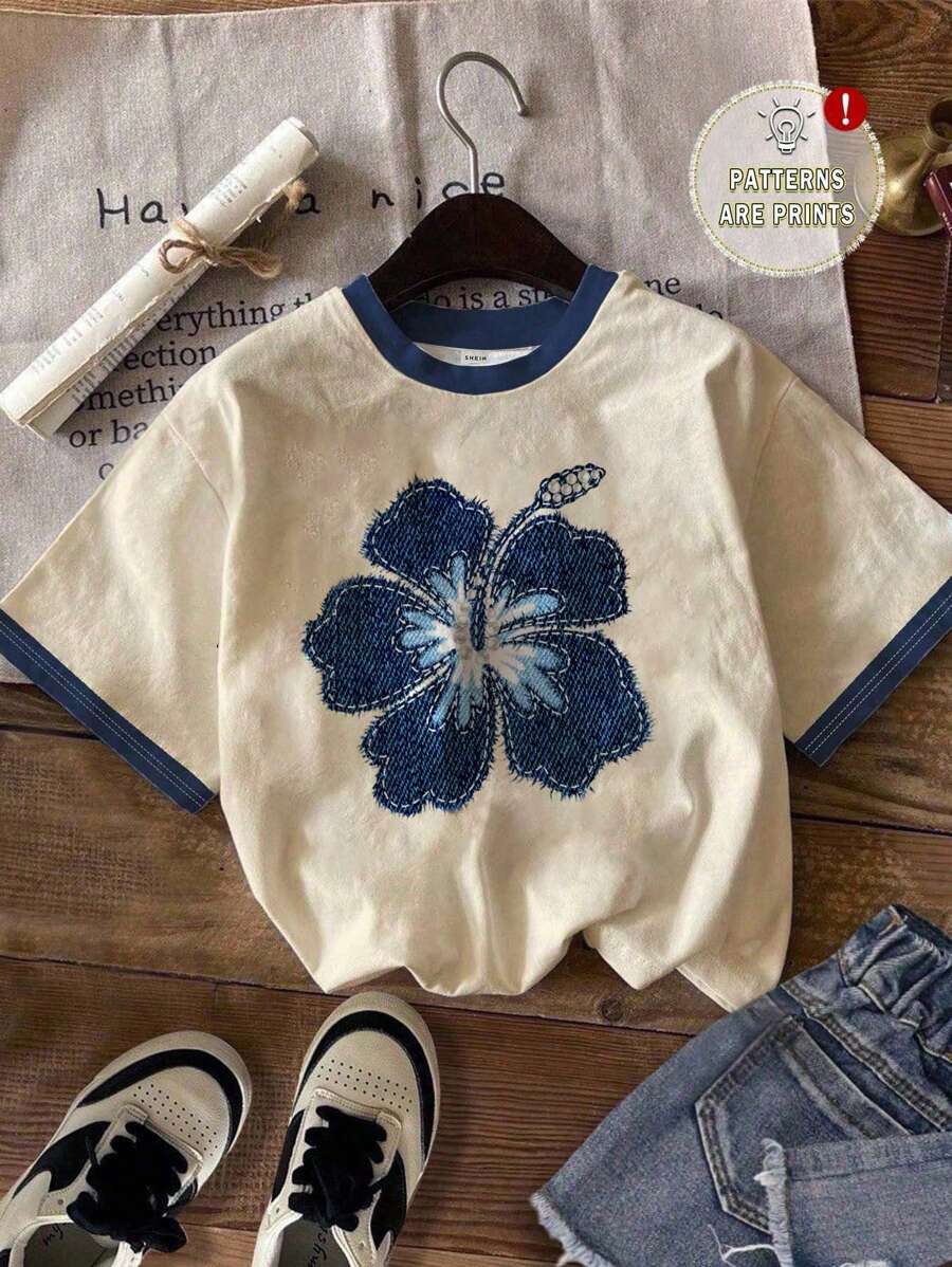 Casual and simple blue floral pattern round neck short-sleeved loose women's T-shirt, suitable for summer Casual and simple blue floral pattern round neck short-sleeved loose women's T-shirt, suitable for summer
