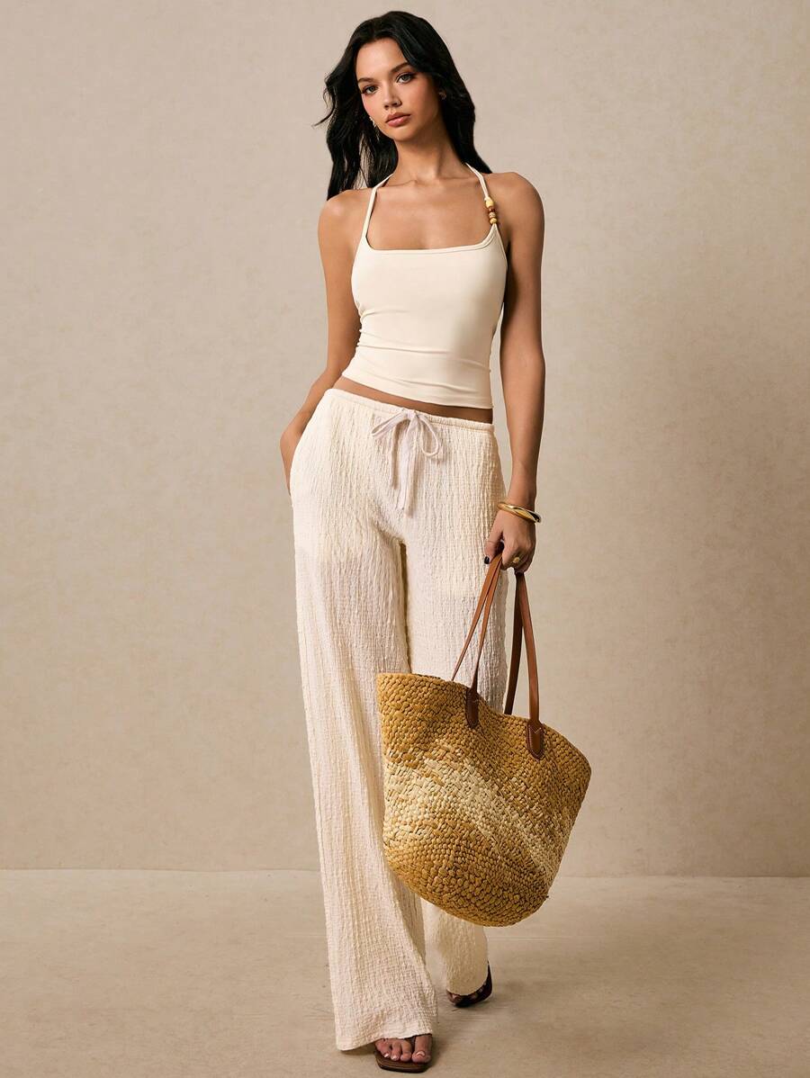 Women's solid color beaded backless crop top, fashionable and slim, suitable for vacations, beach vacations, summer outings and other occasions, bohemian style, European summer style Women's solid color beaded backless crop top, fashionable and slim, suitable for vacations, beach vacations, summer outings and other occasions, bohemian style, European summer style